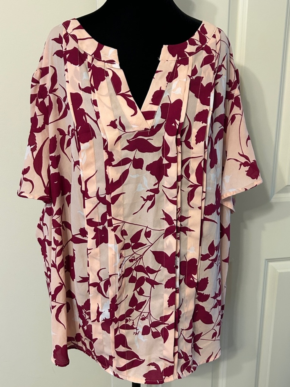 Women's Light Peach V-Neck Tunic Top With a Bold Burgundy Floral Print.